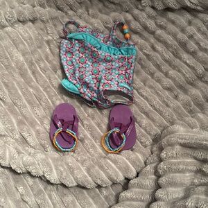 American girl purple bathing suit
